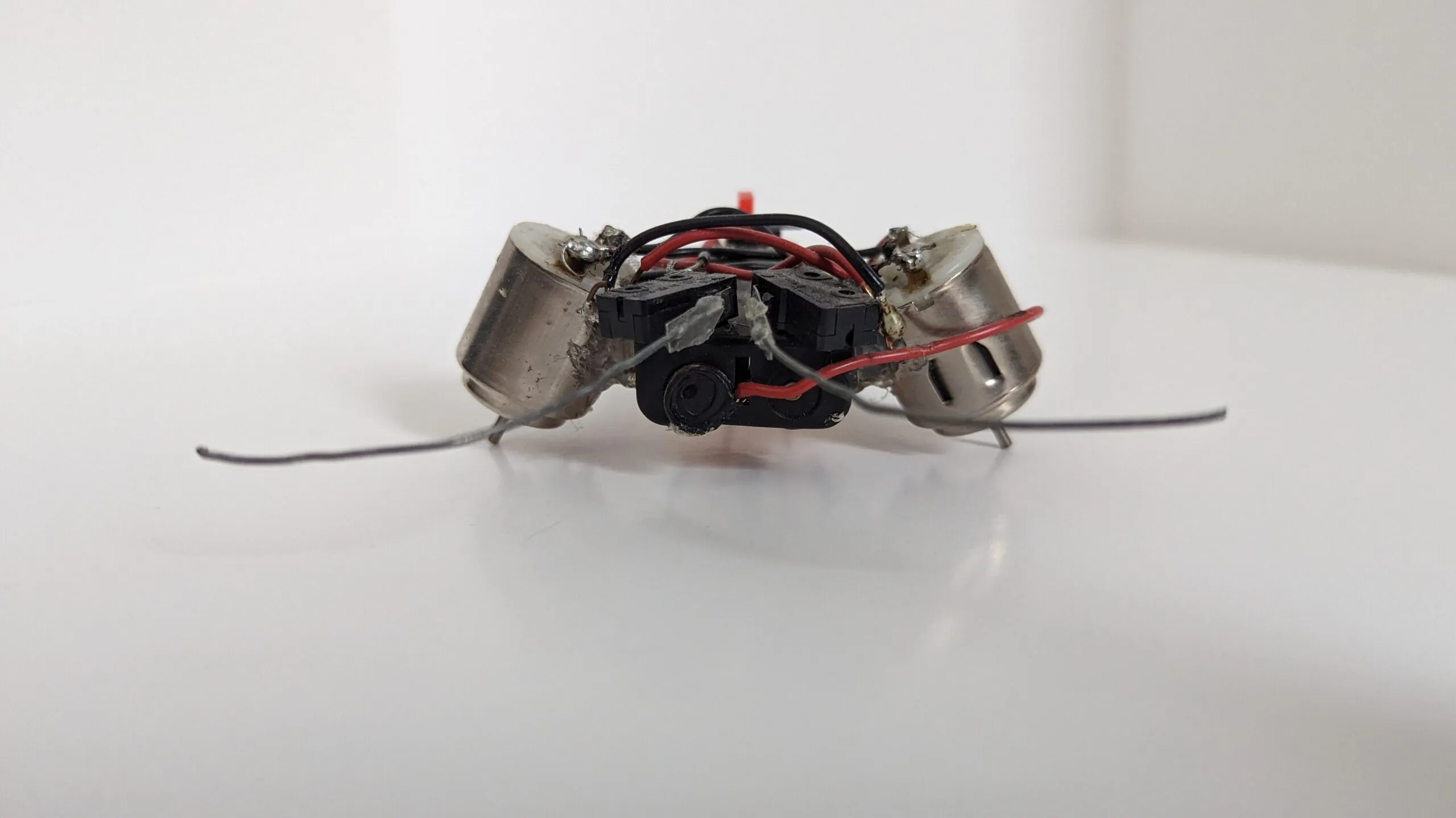 Head-on view of a Beetle with angled motor housings and a bump-switch block between them