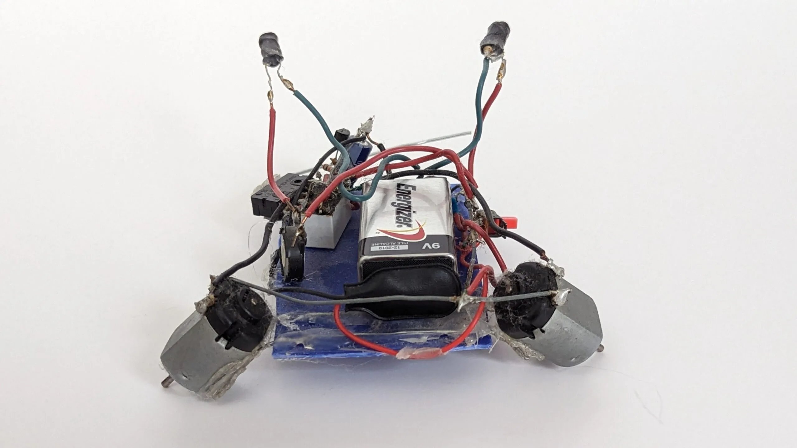 Herbie from behind: photoresistor stalks raised high, drive motors splayed like outriggers