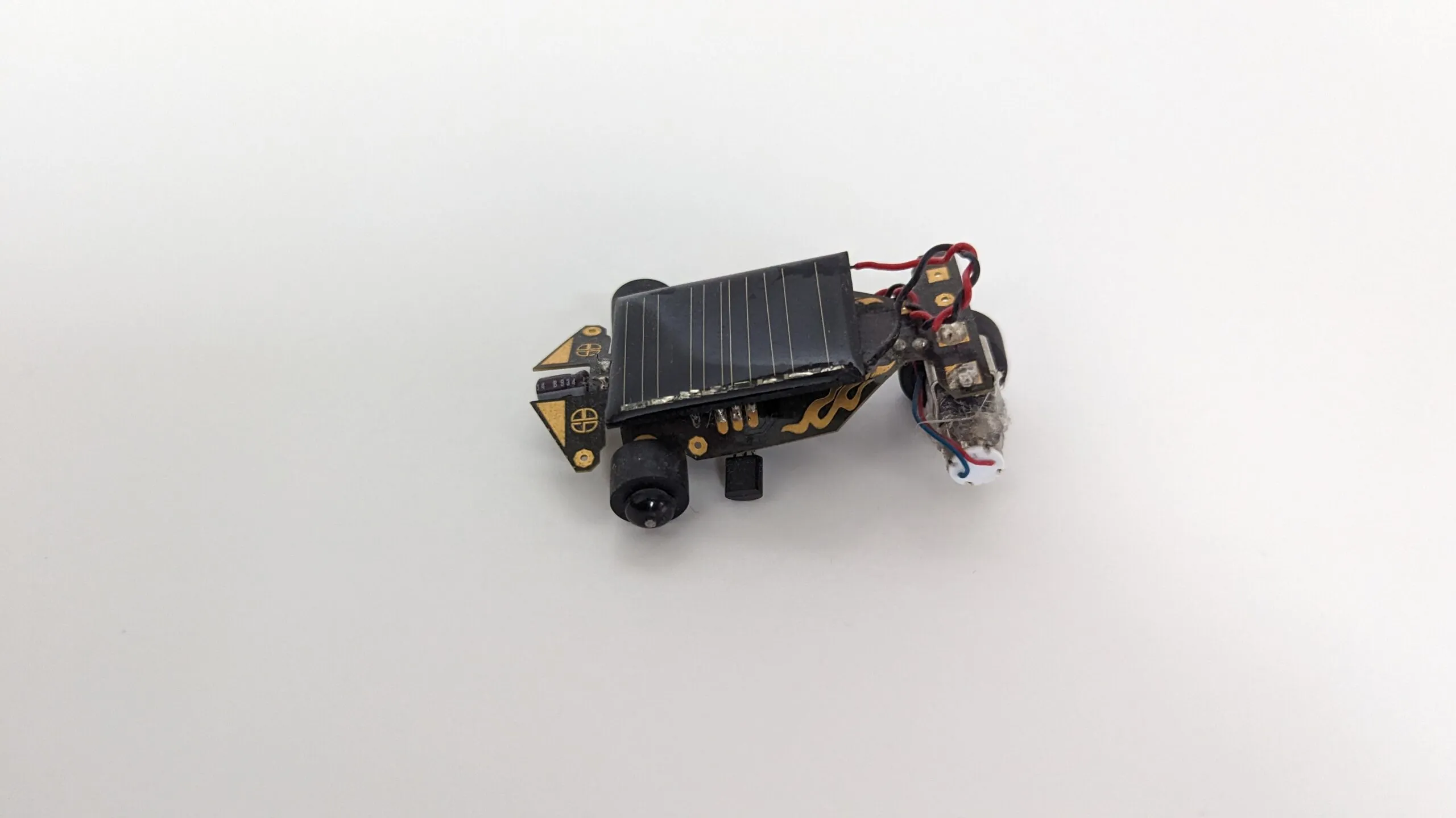 Rear three-quarter view of the Solar Roller, twisted motor leads and a coat of dust