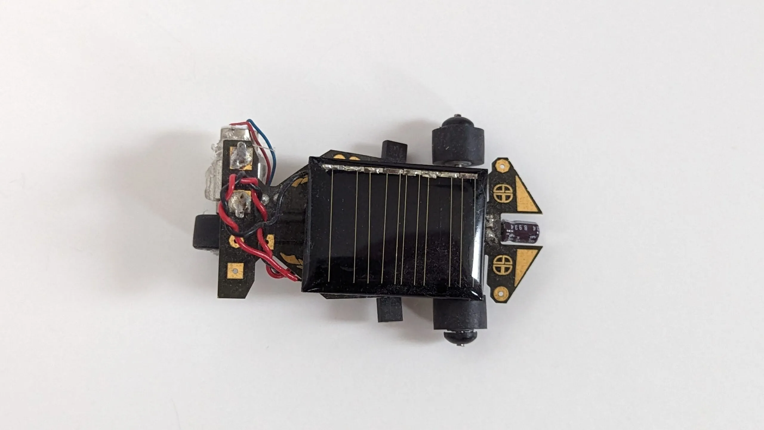Top-down view of the Solar Roller: solar cell centered on the PCB chassis, drive motor at the tail
