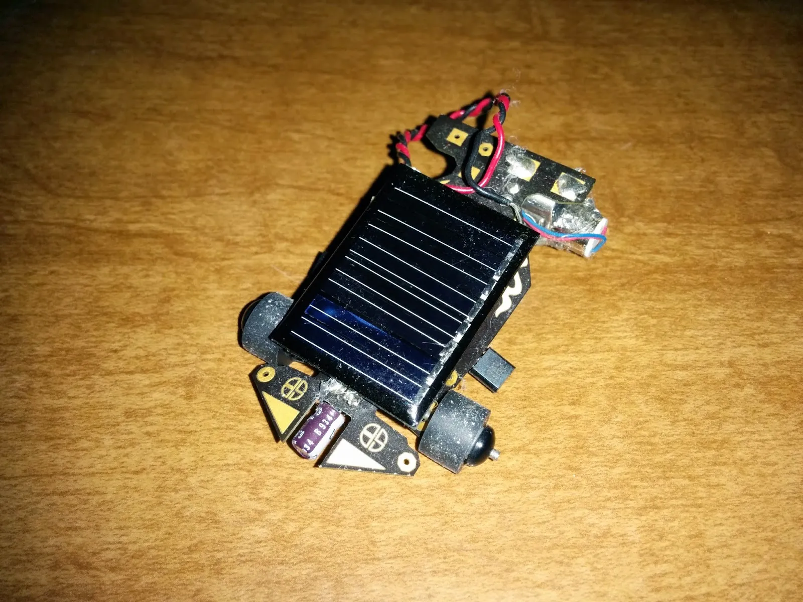 The Solar Roller: a Solarbotics Solar Speeder kit car, small solar cell mounted over the PCB chassis