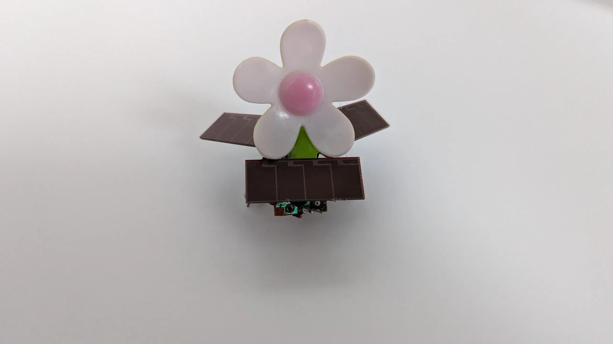 SymFlower v2 face on: daisy centered over the front solar panel, wings level