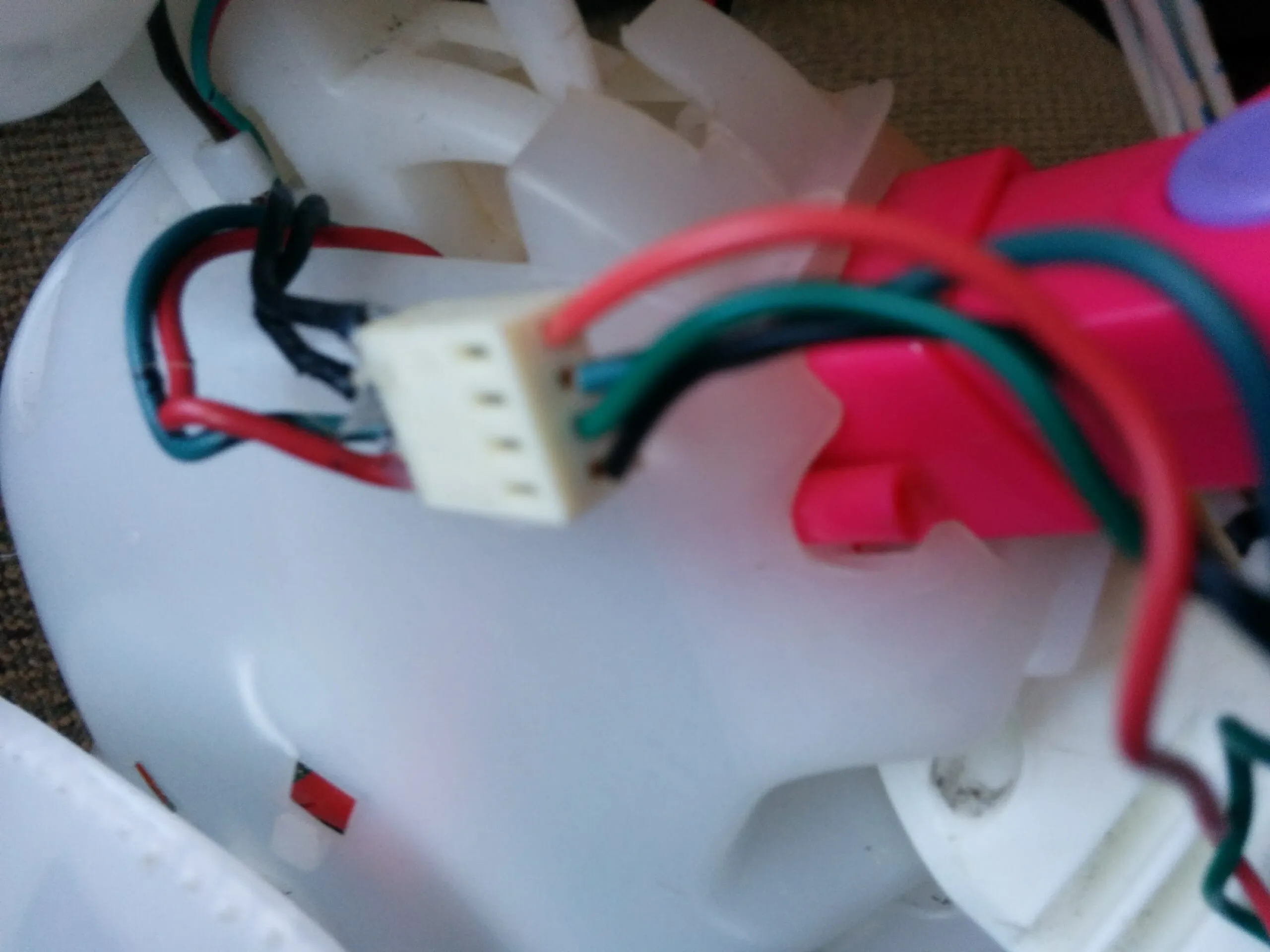 A four-pin connector spliced into Bubbles' wiring harness during the rebuild