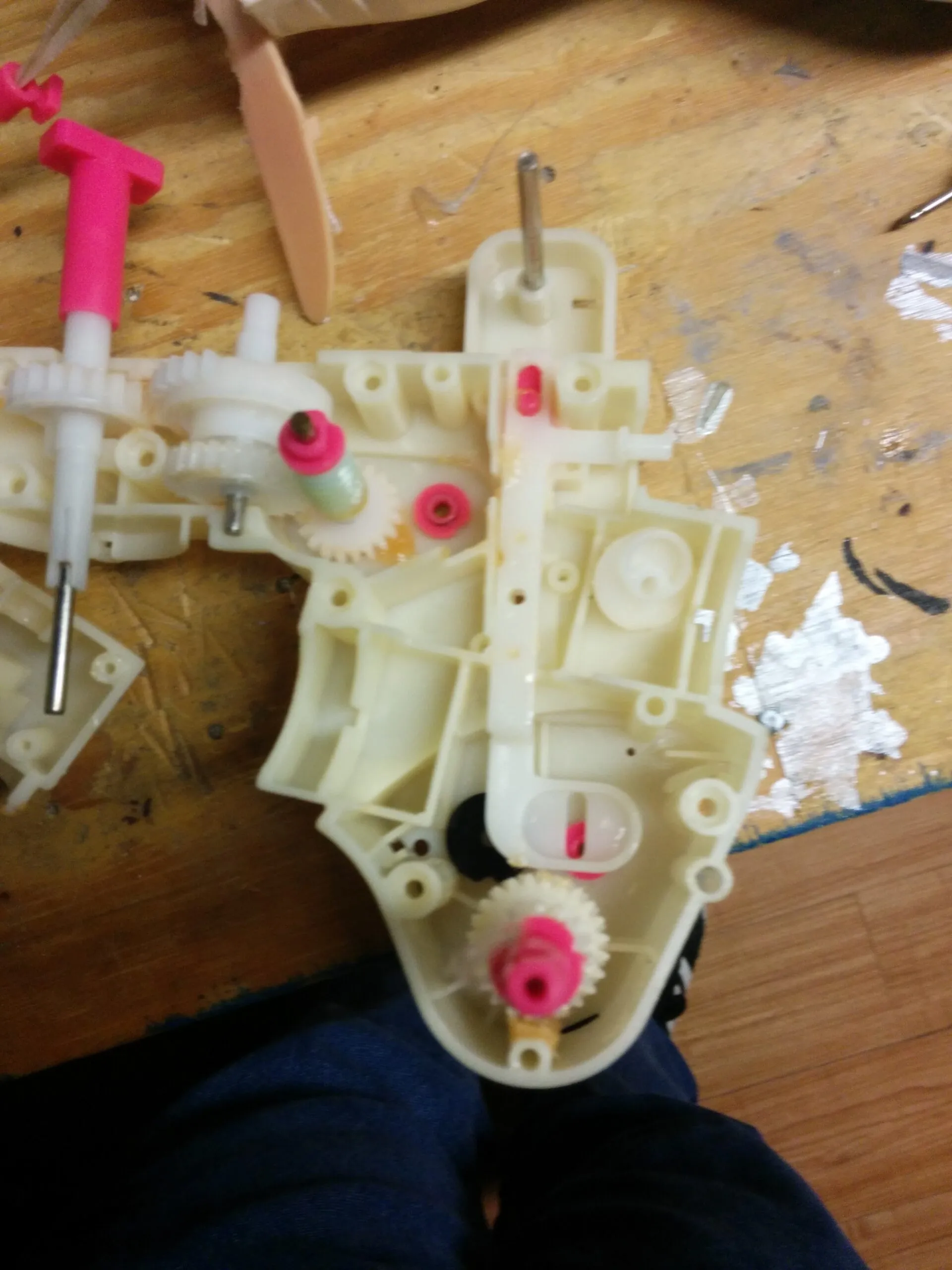 Bubbles' gearbox split open: worm gear and the pink-bushed gear train in the toy's original housing