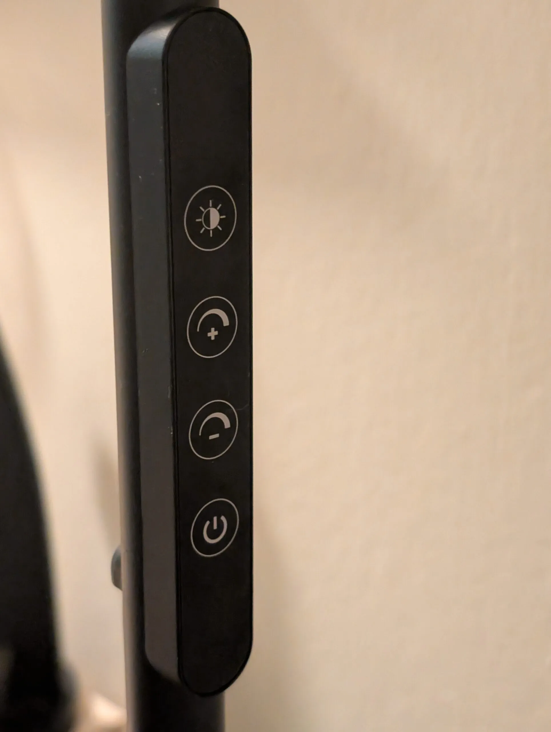 The lamp's touch strip on the pole: color temperature, brighter, dimmer, and power