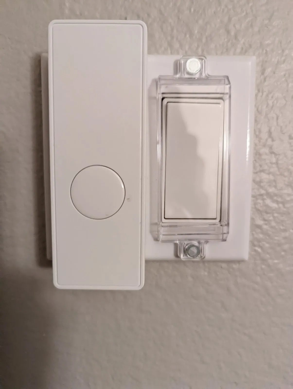 A Third Reality gen 2 smart switch mounted beside the covered rocker it presses