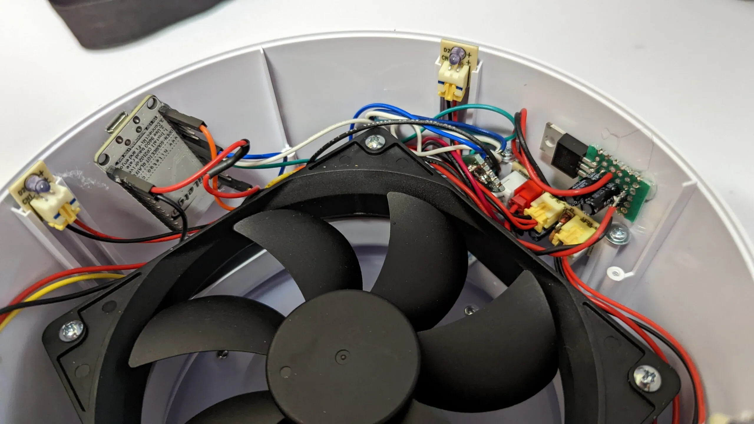 Final wiring around the rim: NodeMCU, regulator, and button boards each in their own bay