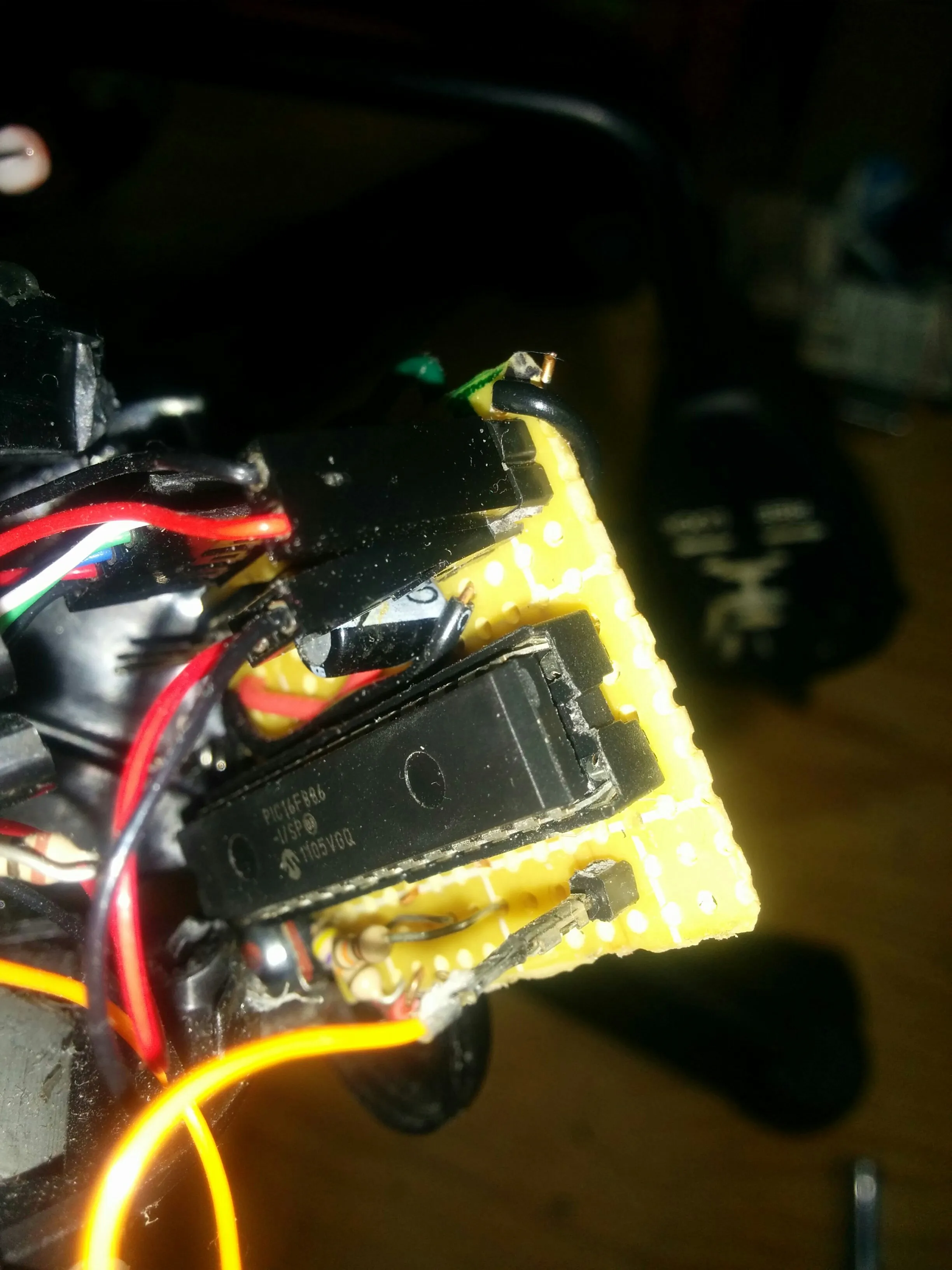 Close-up of the PIC16F886 and driver stacked on Triclops's perfboard