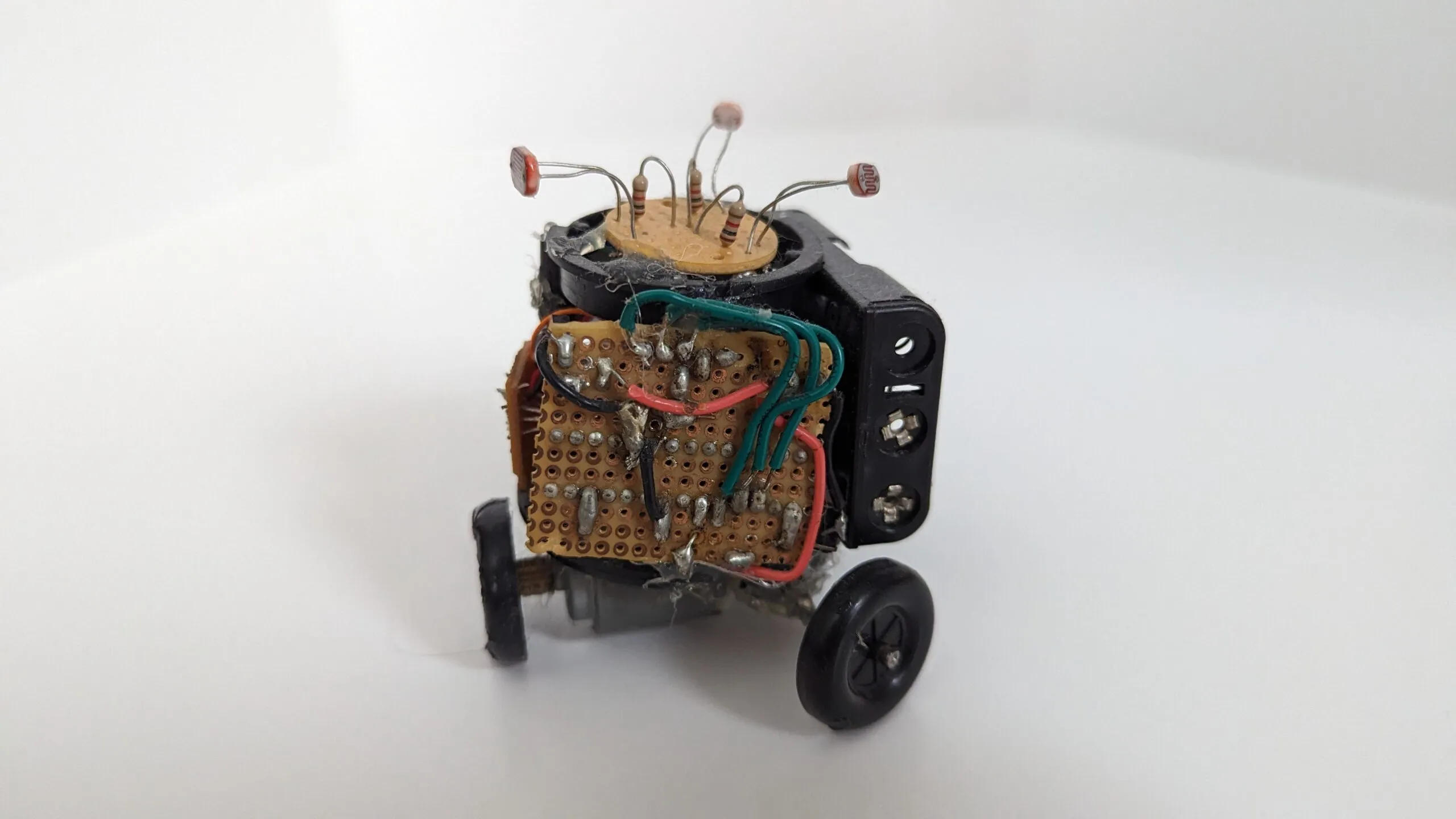 Studio side view of Triclops, the solder side of its perfboard facing out